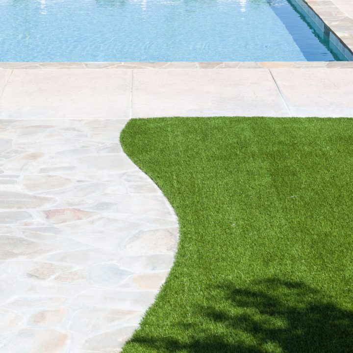 new-artificial-grass-installed-near-walkway-and-pool-stockpack-adobe-stock.jpg